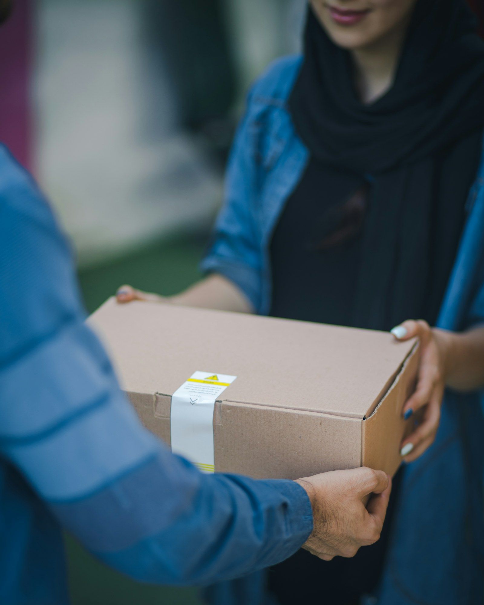 Courier delivering a package to a door